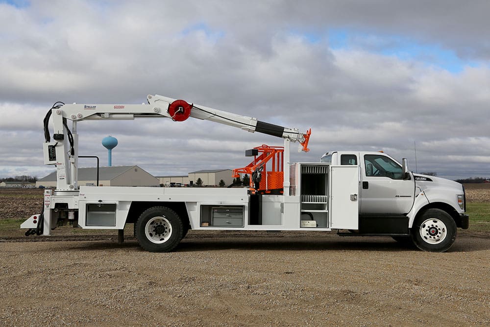 Right side view of 6000MH Specialty Crane with a storage door open