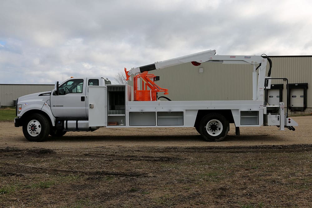 Side view of a 6000MH Specialty Crane with the left side storage door open