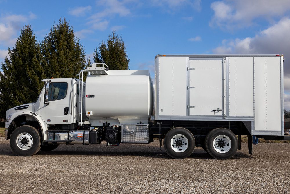 White fuel/lube truck driver side view
