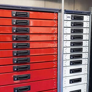 Stellar's innovative work truck drawers with bale-style pull handlers in red and white colors.